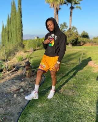 Ddg Wearing A Murakami Los Angeles Hoodie And Lakers Shorts With Supreme Socks And Jordan 12s