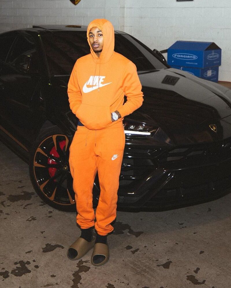 Next To His Lamb In a Nike Orange Hoodie & Joggers With Yeezy Slides | STYLE