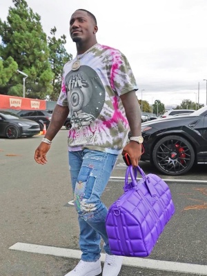 Deebo Samuel Wearing A Gallery Dept Tie Dye Tee With Kapital Patch Jeans Supreme X Nike Sneakers And A Louis Vuitton Bag