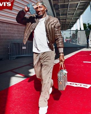 Deebo Samuel Wearing A Rick Owens Bomber Jacket And Pants With A Goyard Bag
