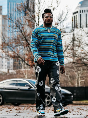 Derrick Henry Wearing A Dior Tears Striped Sweater Levis X Denim Tears Leather Pants And Nike Chunky Dunky Sneakers
