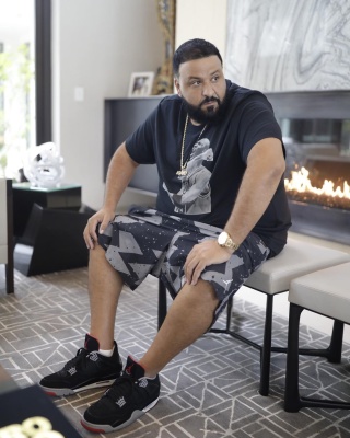 Dj Khaled Wearing A Black Jordan Tee With Black And Grey Jordan Shorts And Black Jordan 3 With A Rolex Watch