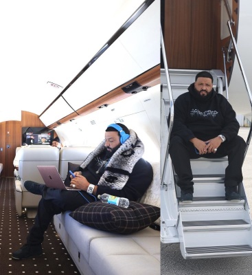 Dj Khaled Wearing A Chanel Grey And Black Fur Scarf With A Balenciaga Sweater And Jordan X Kaws Sneakers