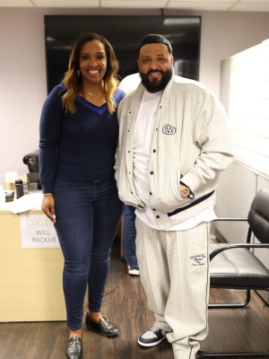 Dj Khaled Wearing A Dior White And Navy Pinstriped Dior Atelier Baseball Jacket And Trackpants With Jordan 1 Sneakers