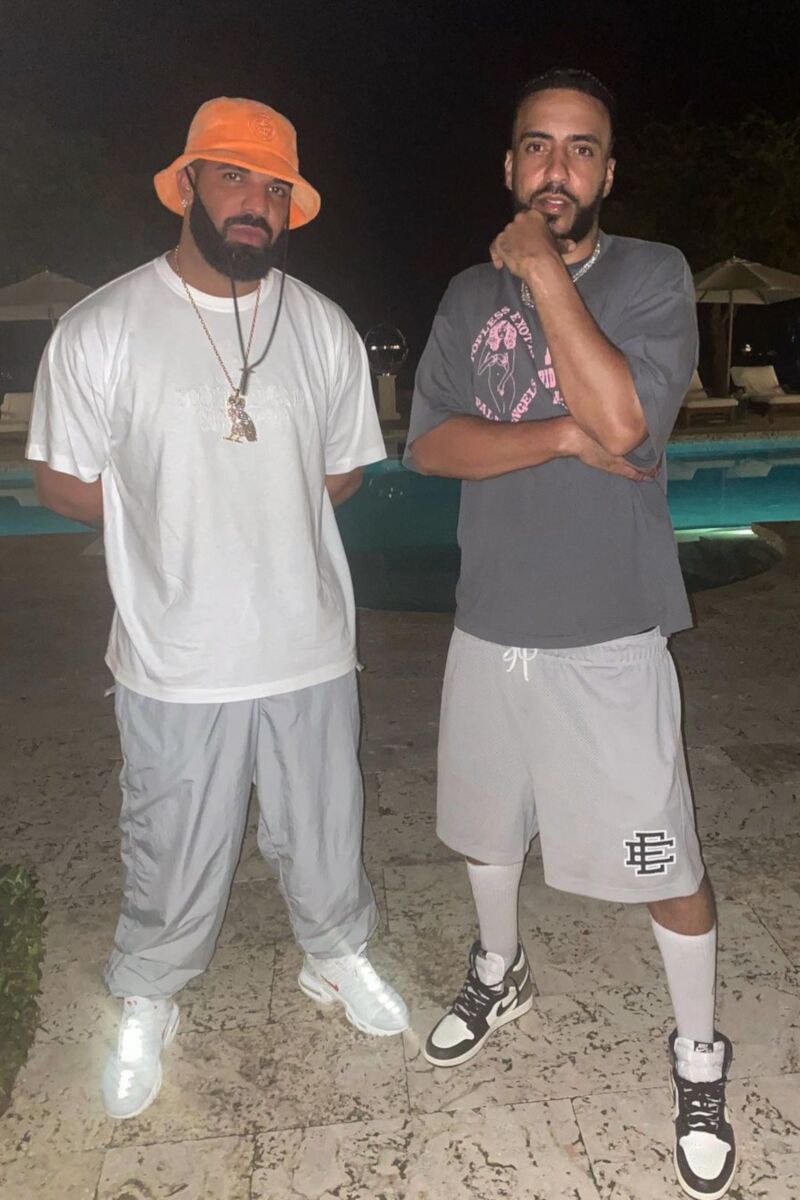 Drake Wearing a Stone Island Bucket Hat & White Tee with Supreme Air Max's