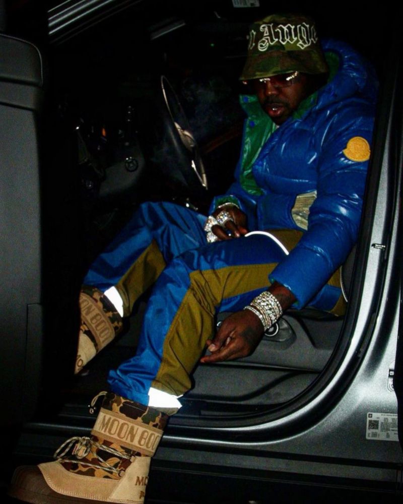 EST Gee Wearing a Moncler Puffer With Moncler x Palm Angels Boots