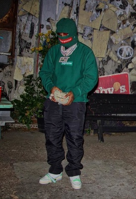 Est Gee Wearing A Supreme Green Box Logo Face Mask And Hoodie With Louis Vuitton Strap Sneakers