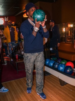 Fabolous Wearing A Louis Vuitton Bucket Hat With A Navy Sweatshirt And Tinted Monogram Jeans