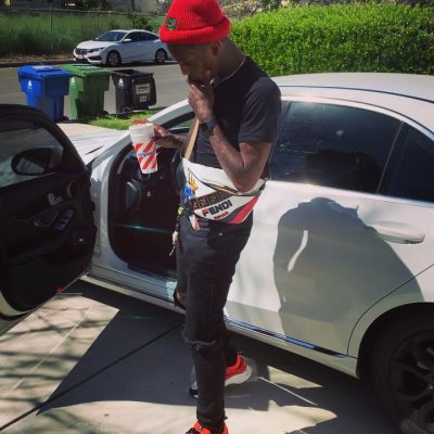 Famous Dex Wearing A Black Tshirt And Red Hat By Ushkay With A Whtie Fendi Mania Bag And Red And Orange Dior B22s