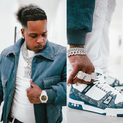 Finesse2tymes Wearing A Louis Vuitton Denim Workwear Jacket With Matching White And Blue Trainer Sneakers