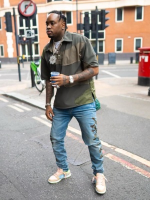 Fivio Foreign Wearing A Who Decides War Olive Green Polo With Amiri Bones Jeans Dunk Sneakers