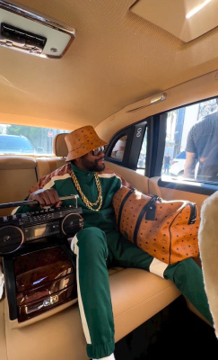 Floyd Mayweather Wearing An Mcm Bucket Hat Tracksuit And Duffle Bag