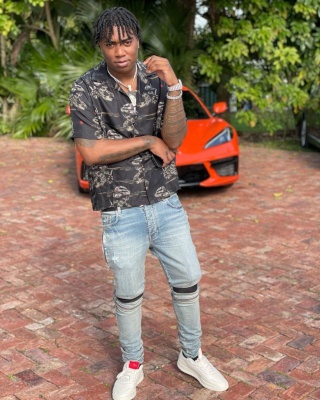 Fredo Band Wearing A Black Snake Shirt With Amiri Jean And 424 Low Top Sneakers