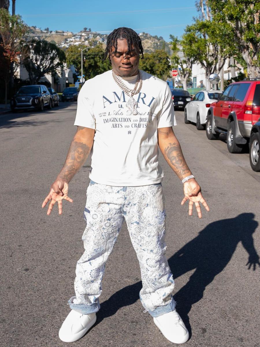 Fredo Bang: Amiri Arts Logo Tee, White Lace Patch Jeans & Puffer Sneakers