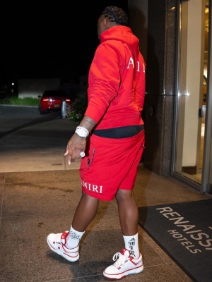 Fredo Bang Wearing An Amiri Red Ma Logo Hoodie With Red Shorts Reaper Logo Socks And Ma1 Skate Sneakers