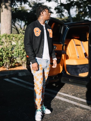 Fredo Bang Wearing An Off White Black Ow Jacket With Amiri X Chemist Jeans And Nike X Off White Dunk Sneakers