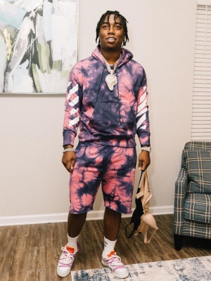Fredo Bang Wearing An Off White Tie Dye Hoodie With Matching Tie Dye Shorts And Nike X Off White Dunk Sneakers