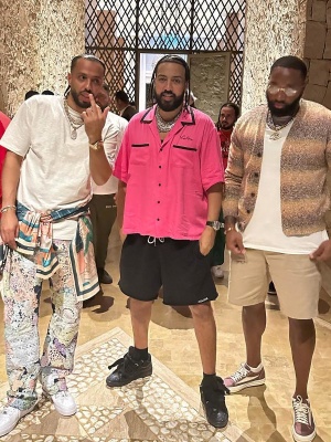 French Montana Wearing A Celine Pink Shirt And Logo Sweatshorts With Low Top Curb Sneakers