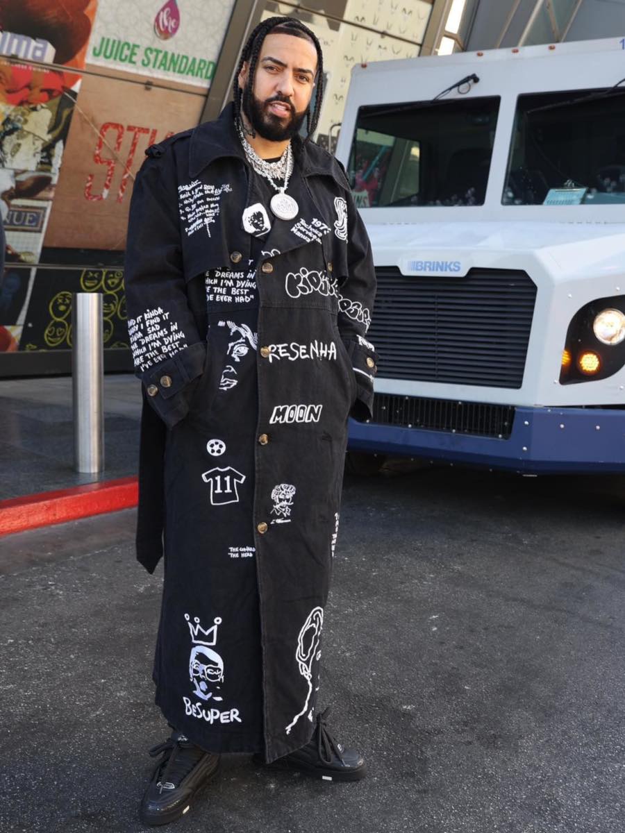French Montana: Black Allover Print Overcoat & Louis Vuitton Black Sneakers