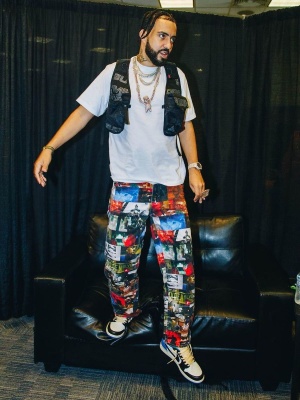 French Montana Wearing A Supreme Vest And Dmx Jeans With Jordan X Travis Scott X Fragment Sneakers