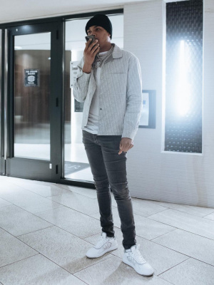 G Herbo Wearing A Dior Grey White Oblique Overshirt With Black Jeans And White And Grey B27 Low Top Sneakers