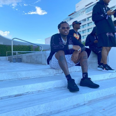 Gucci In Miami Beach Wearing An Amiri Cardigan Jp Sunglasses Gucci Socks And Chanel Sneakers