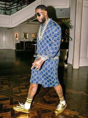 Gucci Mane Wearing A Navy And Gold Gucci Sunglasses Track Jacket Track Shorts And Gold Gucci Sneakers