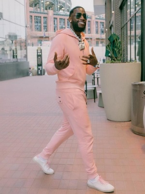 Gucci Mane Wearing A Pink Tom Ford Zip Hoodie And Pink Joggers With Saint Laurent White And Pink Low Top Sneakers