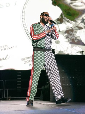Gucci Mane Wearing Louis Vuitton Shelby Sunglasses With A Split Track Jacket And Trackpants With Black Sneakers