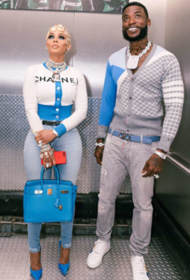Gucci Mane With His Wife Wearing A Grey Cardigan With Grey Dsquared2 Jeans White Sneakers And A Light Blue Ferragamo Belt