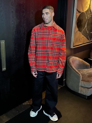 Hakimi Wearing An Off White Red Tartan Shirt With Rick Owens Black Leather High Top Abstract Sneakers