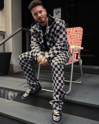 J Balvin Wearing A Black Checkerboard Print Louis Vuitton Jacket Pants And Sneakers