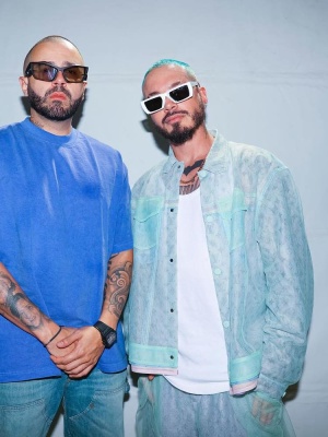 J Balvin Wearing A Louis Vuitton Tulle Jacket And Shorts With Prada Sunglasses