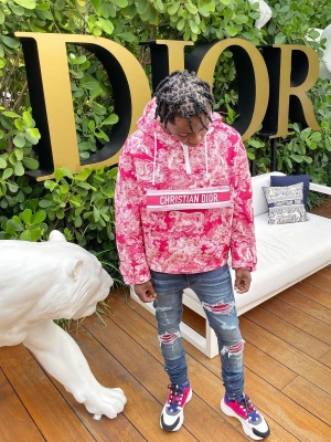 Jackboy Wearing A Dior Fuchsia And White Joy Print Jacket With Amiri Red Underpatch Jeans And Dior Pink Purple B22 Sneakers