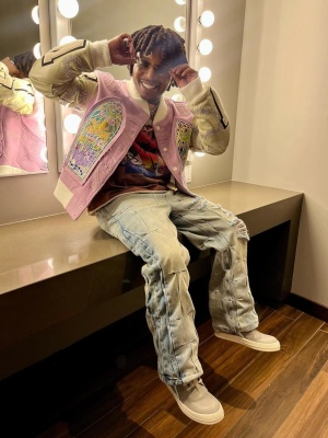 Jacquees Waring A Who Decides War Pink Jacket With A Tropical Shirt Pinched Distressed Jeans And Rick Owens Sneakers