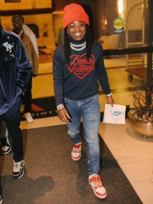 Jacquees Wearing A Louis Vuitton Beanie And Nigo Collab Sweater With White And Red Monogram Sneakers