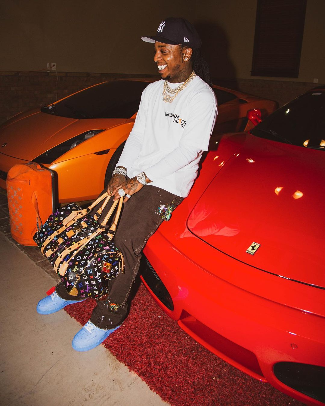 Jacquees Wearing a VLONE Butterfly Tee With Nike x Off-White AF1s & a LV Duffle Bag