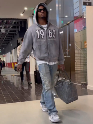 Jamarr Chase Wearing A Rhude X Lamborghini Hoodie And Jeans With Mmy Melted Sneakers
