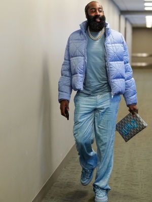 James Harden Wearing A Dior X Erl Light Blue Jacket With Light Blue Quilted Sneakers And A Grey Cd Diamond Pouch Bag