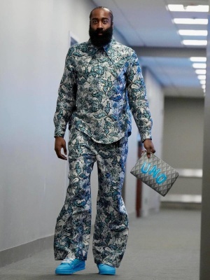 James Harden Wearing A Louis Vuitton Thristle Shirt And Pants With Light Blue Sneakers And A Goyard Pouch