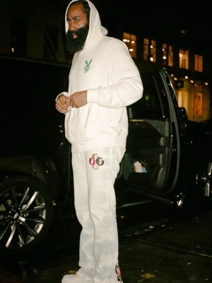 James Harden Wearing An Amiri X Playboy White Hoodie With Gallery Dept Jeans And Bottega Veneta Boots