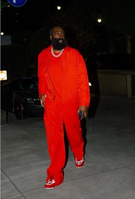 James Harden Wearing An Orange Quilted Jacket And Pants With A Red Honor Tee And Louis Vuitton Skate Sneakers