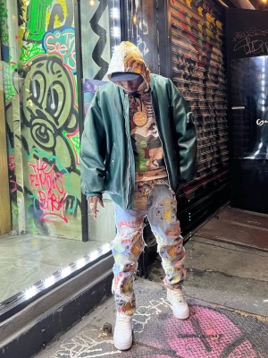 Joey Badass Wearing A Prada Green Leather Bomber Jacket With A Who Decides War Hoodie And Nike Air Force 1 Sneakers
