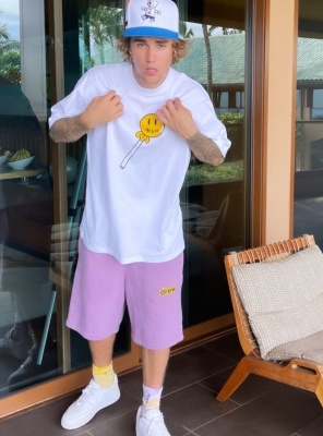 Justin Bieber Wearing A Drew House Bear Trucket Hat Lolly Pop T Shirt And Pink Shorts