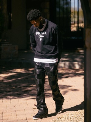 Key Glock Wearing A Prada Logo Sweatshirt With Amiri Leather Suede Square Patchwork Pants And Jordan Sneakers