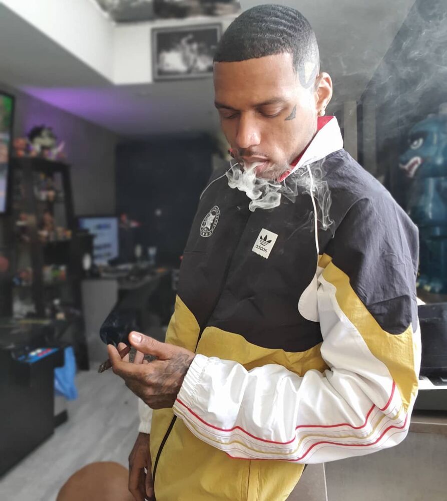 Kid Ink Wearing a Black and Gold Adidas Jacket