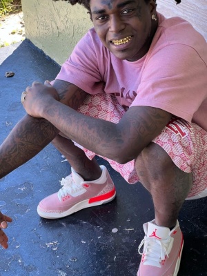 Kodak Black Wearing A Pink Human Made X Lil Uzi Vert Tee With Pink Eric Emanuel Shorts And Pink Jordan 3s