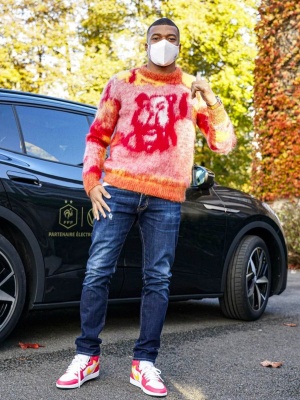 Kylian Mbappe Wearing A Dior X Peter Doig Sweater With Jeans And Jordan 1 Retro High Sneakers