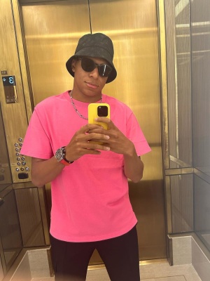 Kylian Mbappe Wearing A Louis Vuitton Bucket Hat With Oakley Sunglasses And A Dior Tee