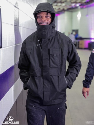 Lamar Jackson Wearing A Nike Hooded Jacket And Louis Vuitton Carpenter Pants